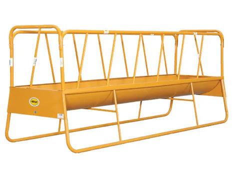 Cattle eating from Sioux Steel 12′ Bunk Feeder designed to minimize feed waste and ensure easy livestock access.