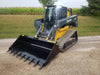 Stinger skid steer tooth bucket moving gravel pile – heavy-duty construction delivers smooth operation and long service life.