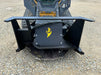 Stinger Decimator skid steer disc mulcher in wooded area removing brush – reliable attachment for forestry, farming, and land management.