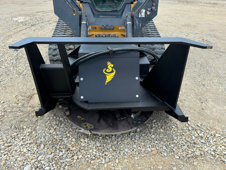 Stinger Decimator skid steer disc mulcher in wooded area removing brush – reliable attachment for forestry, farming, and land management.
