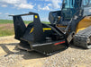 Powerful skid steer disc mulcher by Stinger grinding vegetation on rugged terrain – ideal for land clearing and forestry management.