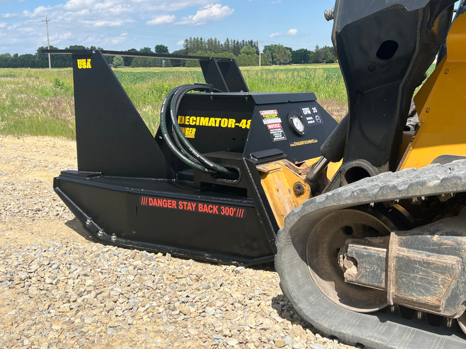 Operator using Stinger skid steer disc mulcher to clear overgrown land – reliable solution for brush control and property maintenance.