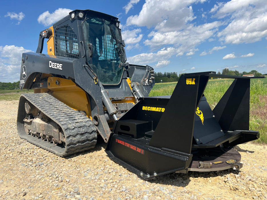 Stinger Decimator skid steer disc mulcher clearing thick brush and small trees – heavy-duty forestry attachment built for extreme performance.