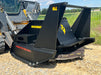 Stinger Decimator disc mulcher attached to skid steer clearing roadside vegetation – dependable forestry tool for commercial use.