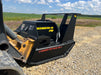 Durable skid steer disc mulcher by Stinger tackling thick brush and wood debris – designed for rugged terrain and heavy workloads.