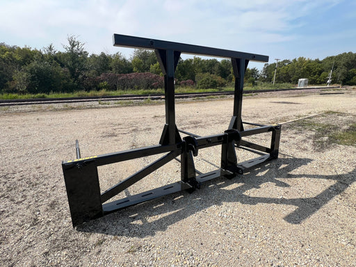 Stinger Series 5XD skid steer bale spear lifting multiple large hay bales – heavy-duty attachment built for high-capacity farm operations.