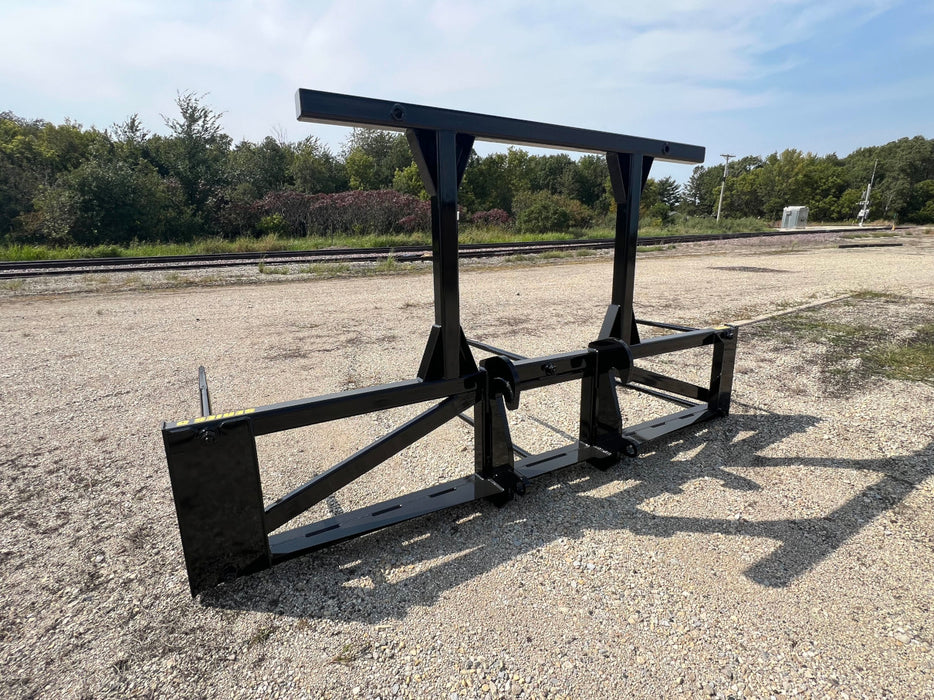 Stinger Series 5XD skid steer bale spear lifting multiple large hay bales – heavy-duty attachment built for high-capacity farm operations.