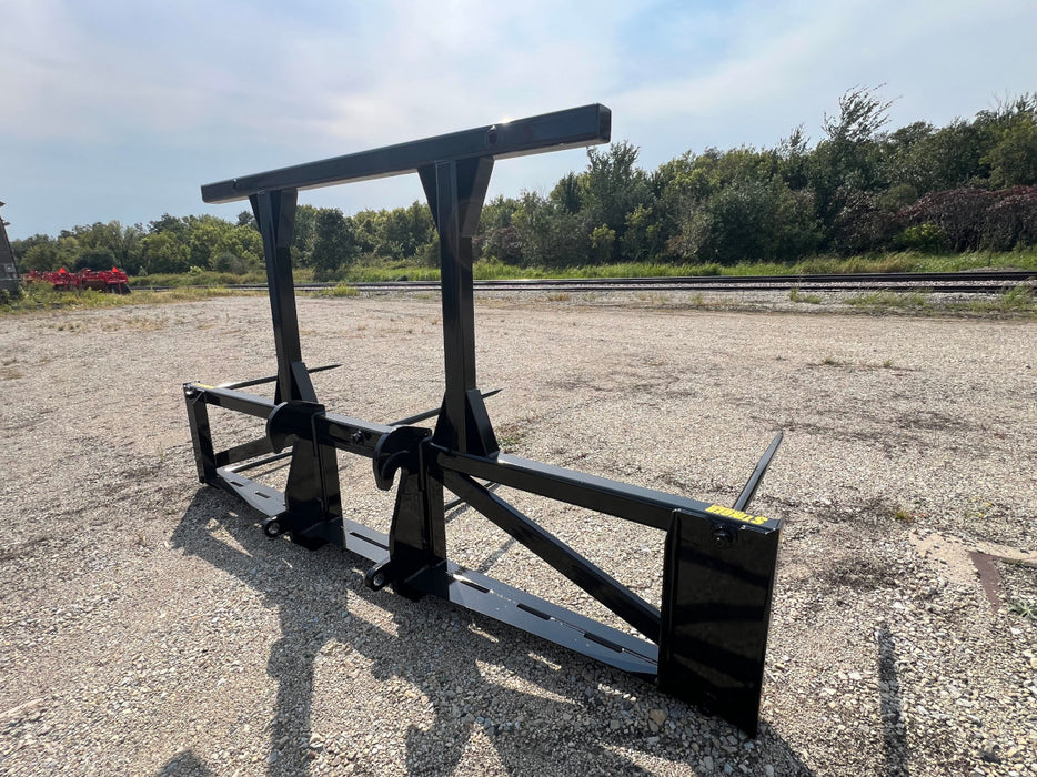 Powerful bale spear by Stinger handling stacked hay bales – multi-bale mover designed for efficiency and durability on modern farms.