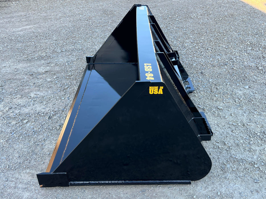 Heavy-duty skid steer manure bucket moving straw and waste – professional-grade attachment for efficient material handling.