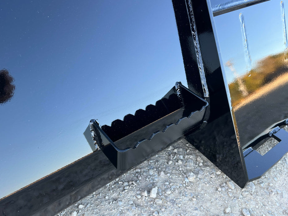 Skid steer manure bucket by Stinger removing slurry from feedlot – reliable design for smooth operation and easy cleanup.