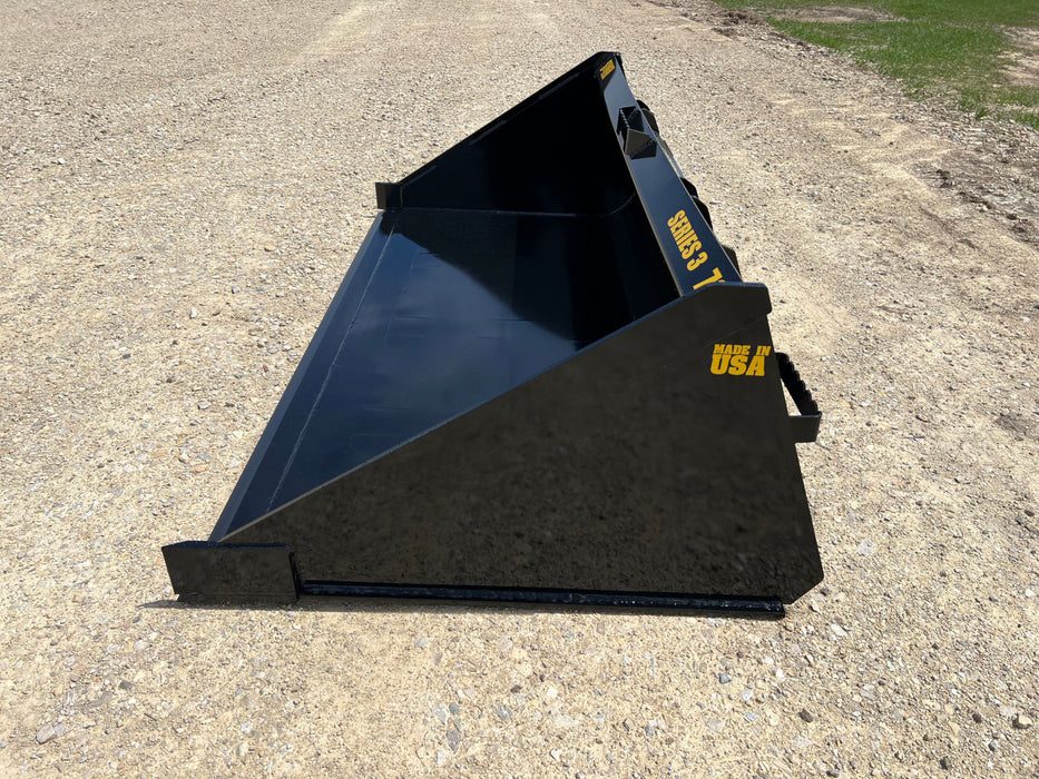Stinger Series 3 heavy-duty skid steer material bucket carrying compacted soil – precision-built for efficient material handling.