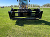 Side view of the tractor rock bucket demonstrating open-design spacing for effective rock sifting and debris removal.