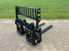 Heavy-duty skid steer pallet forks by Stinger moving large industrial loads – durable Class 3 design for high-capacity material transport.