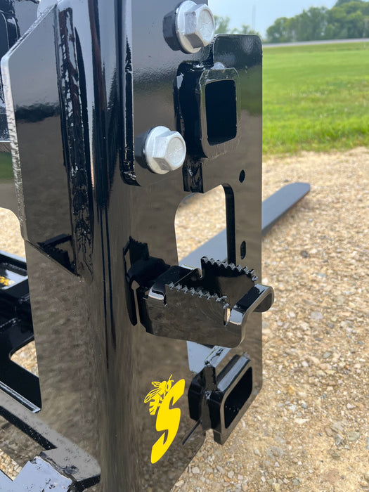 Close-up of Stinger hydraulic skid steer pallet forks tines and frame – engineered for strength, safety, and long-lasting reliability.