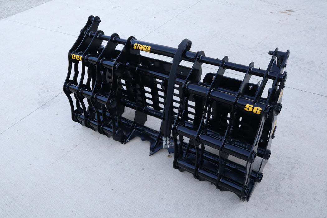 Close-up of compact tractor grapple bucket jaws and hydraulic arms – reinforced steel construction ensures long-lasting durability and performance.