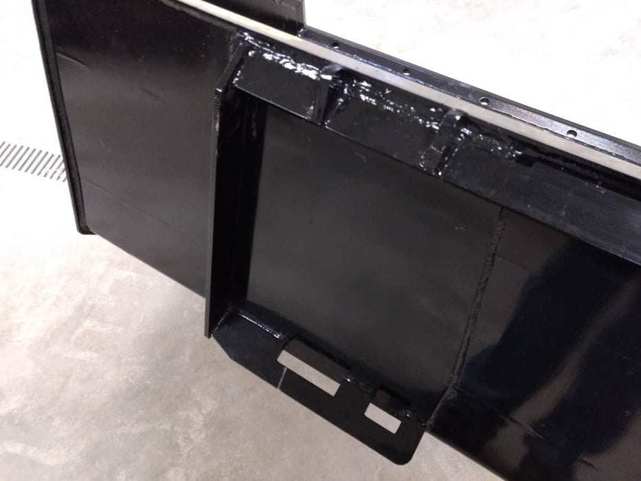 Heavy-duty skid steer material bucket by Stinger carrying gravel and dirt – durable Series 1 design for landscaping and farm applications.