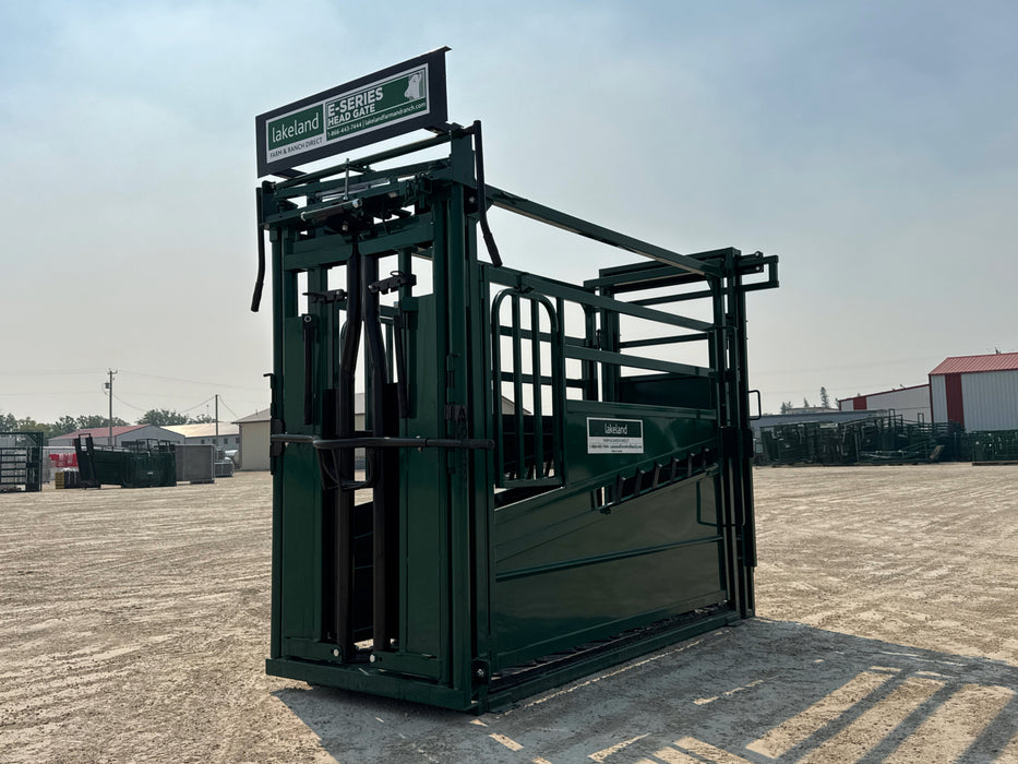 Lakeland E-Series cattle squeeze chute with head gate and side access doors for safe livestock handling