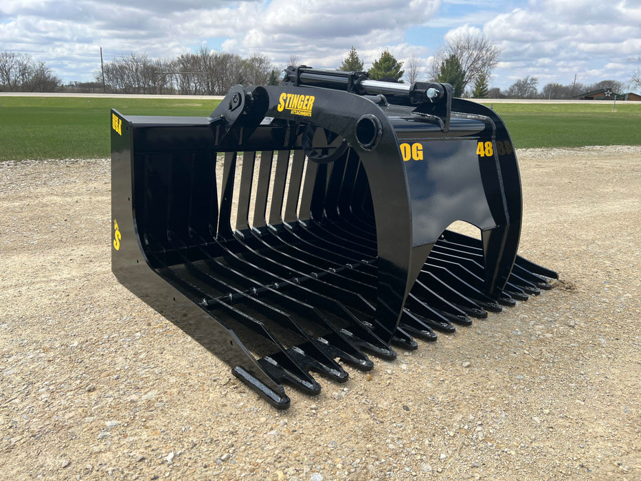 48-inch heavy-duty skid steer grapple bucket lifting rocks and debris – durable attachment designed for efficient land clearing and material handling