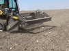 Close-up of Stinger skid steer rock reel attachment rolling debris – efficient screening design for fast and effective cleanup.