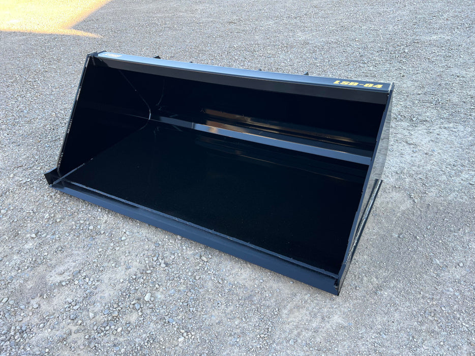 Front view of heavy-duty skid steer manure bucket lifting farm waste – versatile attachment for manure, mud, and debris removal.