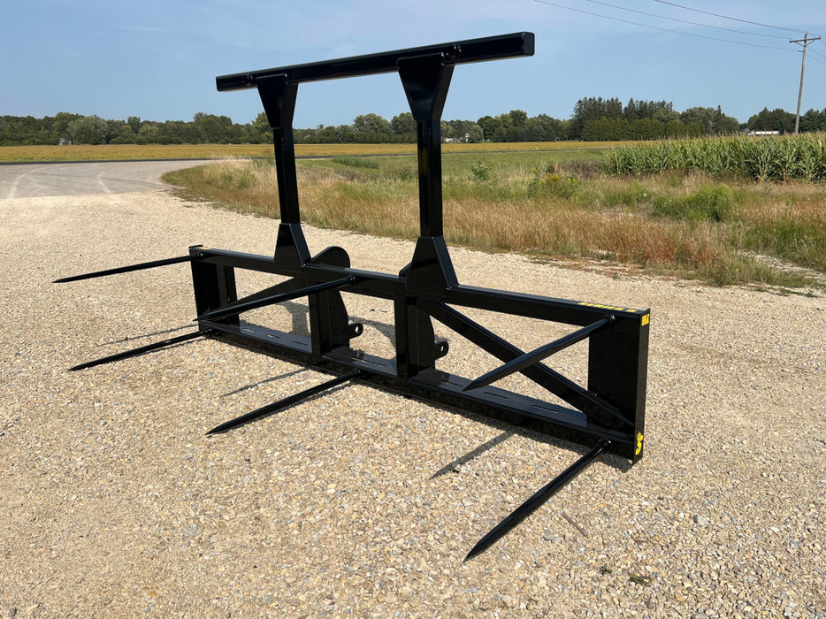 Rear angle of the Bale Spear Series 5XD showing quick-attach bracket and durable welded joints.
