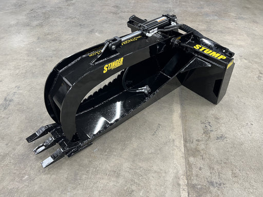 Heavy-duty skid steer stump bucket with grapple removing tree roots – powerful attachment built for efficient land and stump clearing.