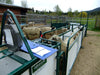 Portable modular sheep handling system with smooth crowding tub design