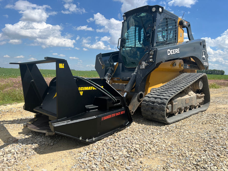 Stinger Decimator skid steer disc mulcher working in forest clearing operation – professional-grade tool for efficient vegetation control.