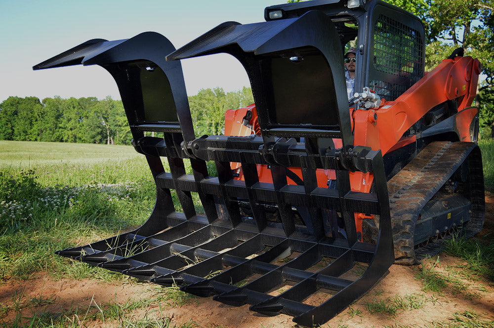 Loflin Monster Root Grapple attached to a skid steer clearing heavy debris and roots – durable skid steer root grapple built for maximum power and efficiency on tough jobsites.