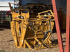 Farmer operating HiQual Hydraulic Calf Chute for smooth restraint and secure calf management on the ranch.