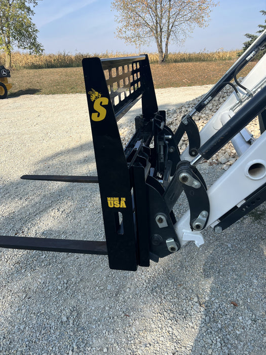 Close-up of Stinger skid steer pallet fork tines and reinforced frame – engineered for strength, balance, and long-lasting performance.