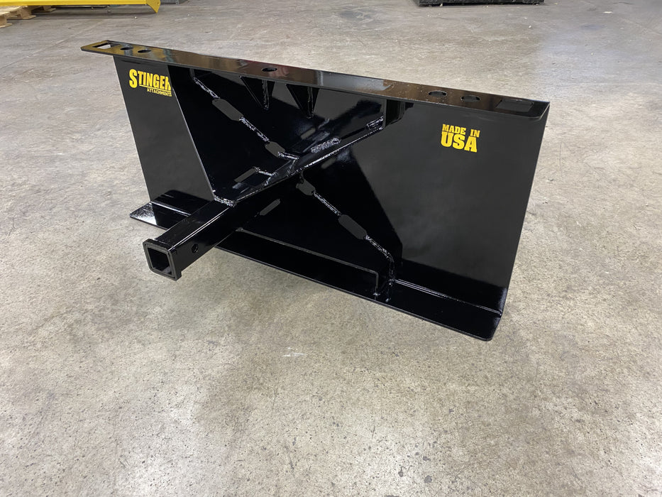 Stinger skid steer receiver hitch mounted on loader – strong and reliable tool for easy trailer positioning and transport.