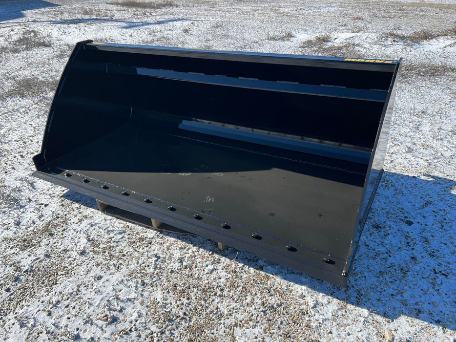Operator using high capacity skid steer bucket to move silage – reliable attachment ideal for farming, feeding, and material transport.