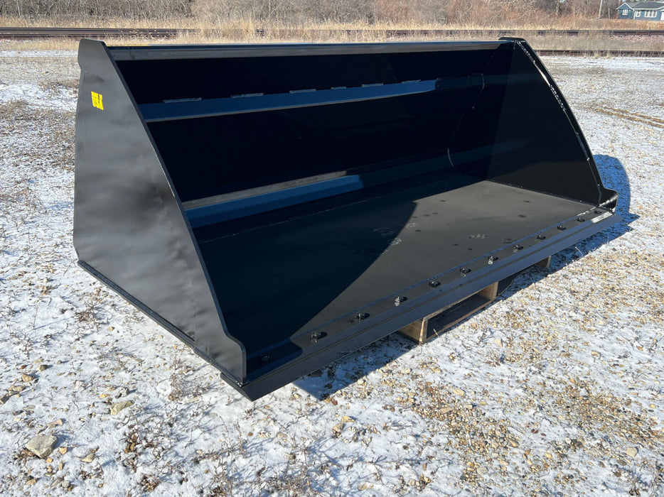 Durable high capacity skid steer bucket moving hay and grain – built for power, precision, and everyday farm productivity.