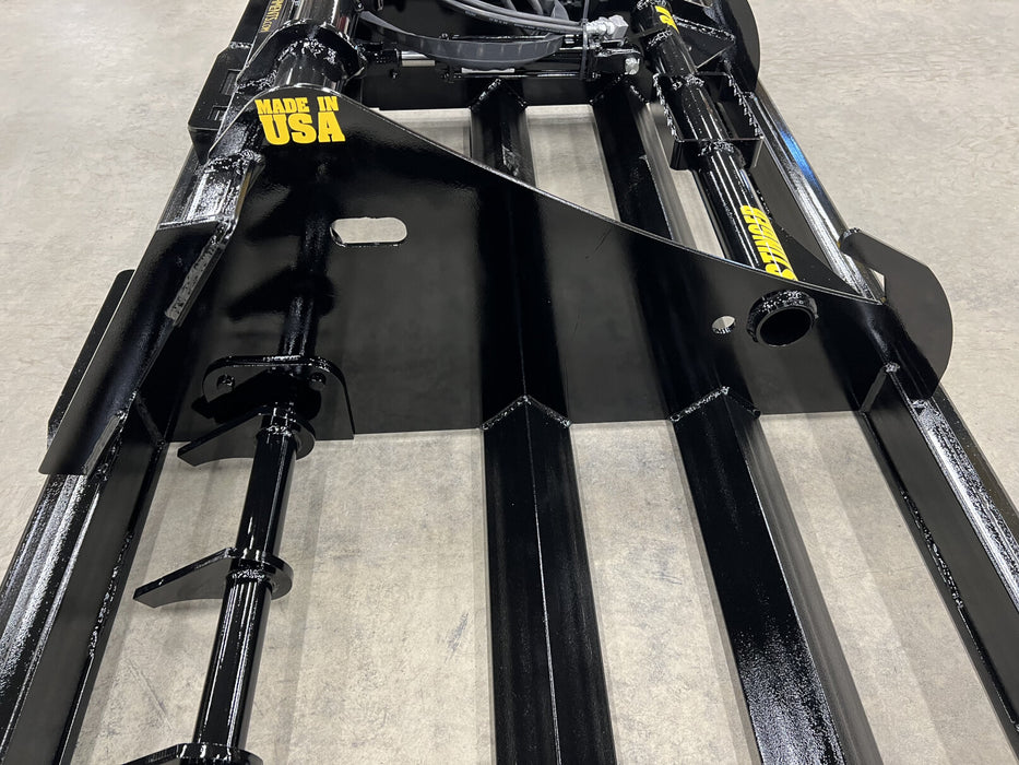 Durable skid steer land plane by Stinger reshaping gravel path – engineered for strength, control, and consistent results on any jobsite.