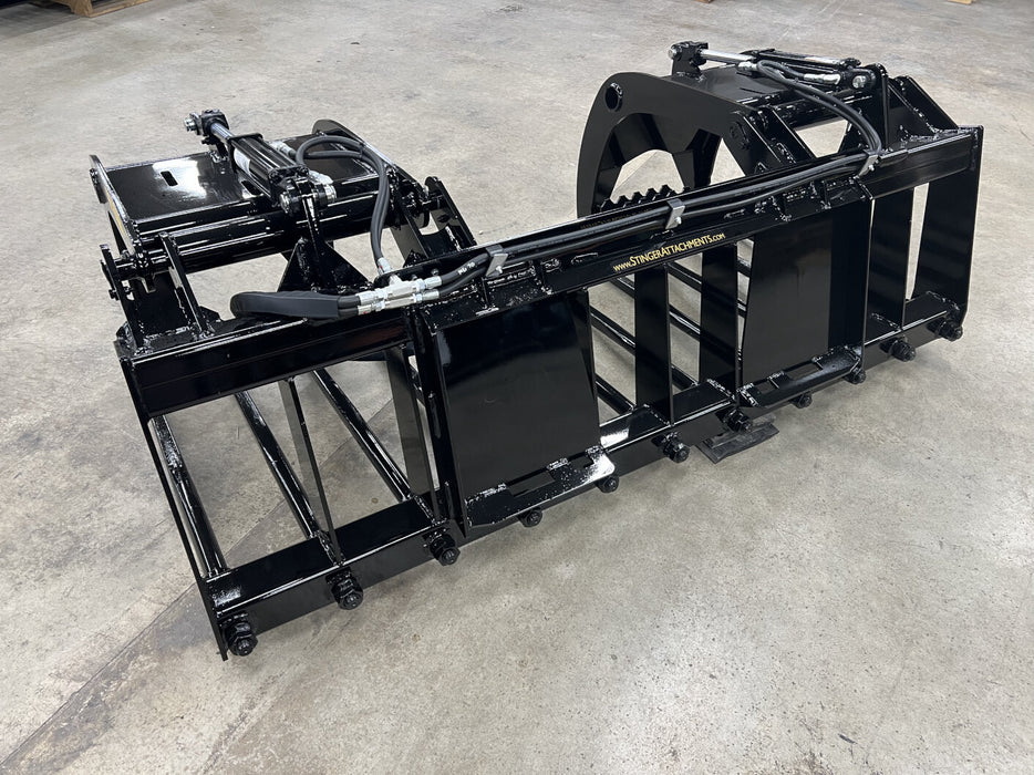 Heavy-duty skid steer manure grapple by Stinger moving livestock waste – durable MG-Series attachment for barns and feedlots.