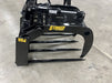 Durable Stinger skid steer manure grapple scooping hay and debris – perfect for clearing feedlots, barns, and corrals.
