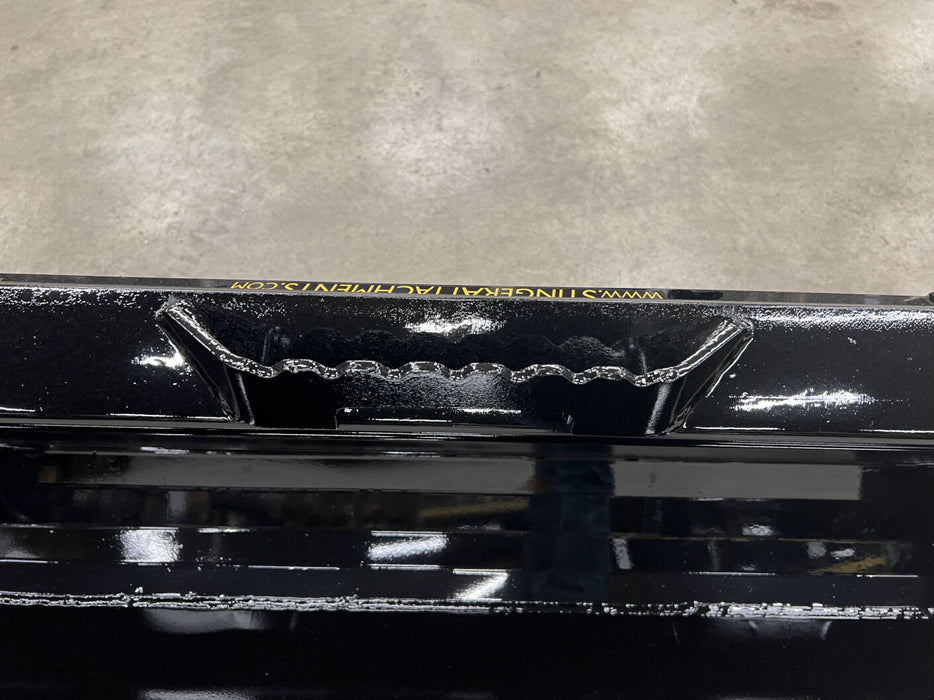 Stinger skid steer material bucket dumping debris on worksite – efficient and durable attachment for heavy-duty material management.