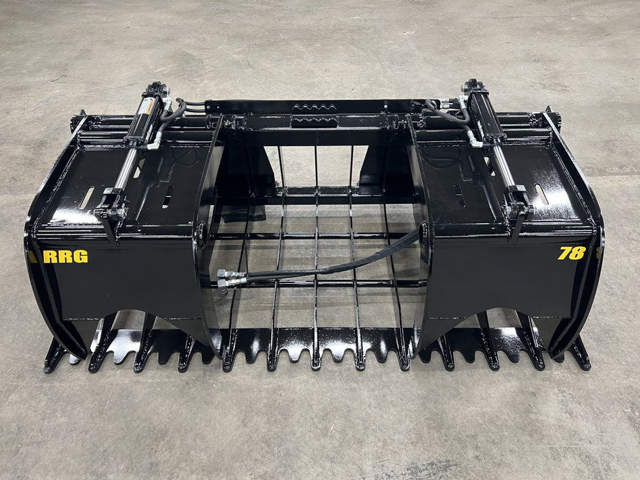 Heavy-duty Rock Grapple with dual clamp arms demonstrating strong hold and efficient ground penetration.