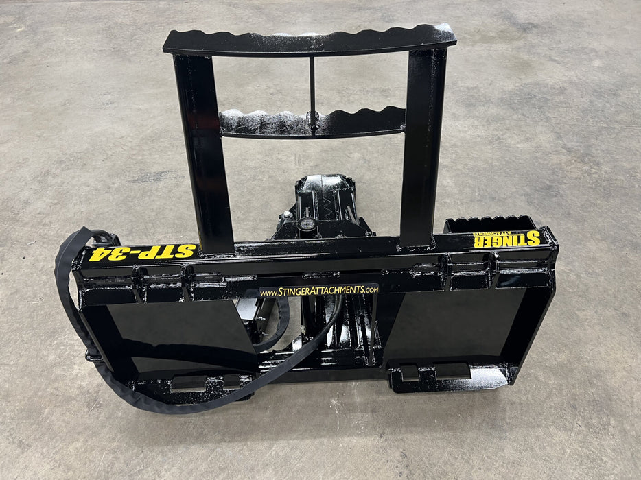 Heavy-duty skid steer tree puller attachment removing deep roots – professional-grade tool built for efficient land management.