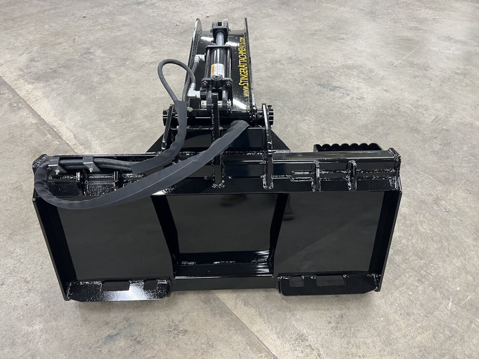 Stinger skid steer stump bucket with grapple lifting tree stump – strong and versatile attachment for professional contractors.