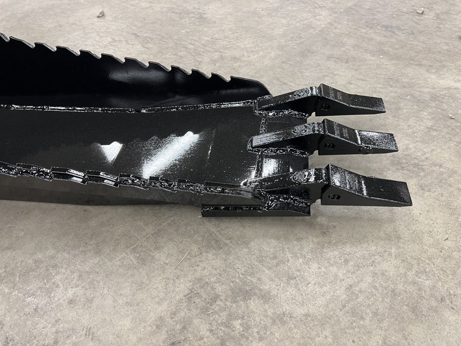 Operator using Stinger skid steer stump bucket to remove large stump – professional-grade attachment ideal for forestry and landscaping.