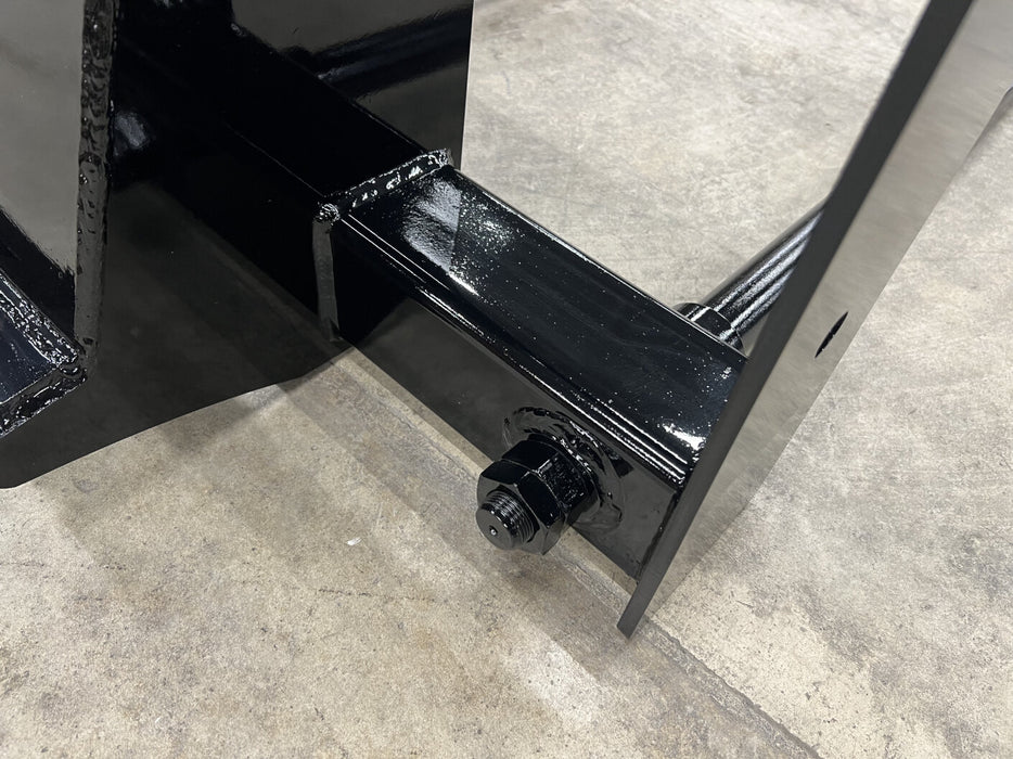 Professional-grade bale spear by Stinger lifting hay bale stack – superior control and balance for tractors and skid steer loaders.