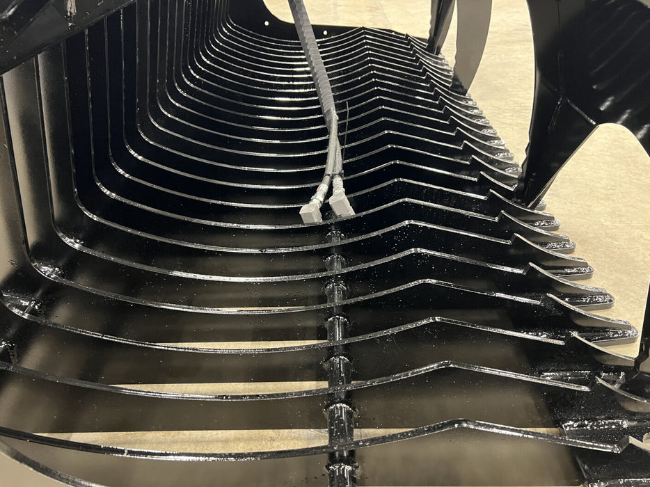 Operator using heavy-duty skid steer rock bucket to remove rocks – reliable attachment designed for landscaping and construction projects.