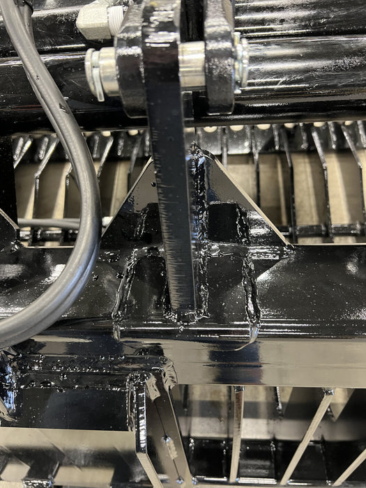 Skeleton skid steer rock bucket by Stinger screening stones and rubble – efficient attachment built for precision and long-term use.