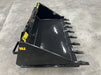 Operator using skid steer tooth bucket to dig and move dirt – rugged design ideal for construction, landscaping, and farm work.