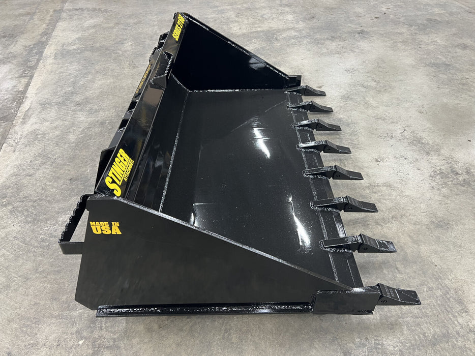 Operator using skid steer tooth bucket to dig and move dirt – rugged design ideal for construction, landscaping, and farm work.