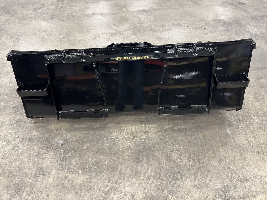 Durable skid steer tooth bucket breaking through hard ground – replaceable teeth provide superior penetration and easy maintenance.