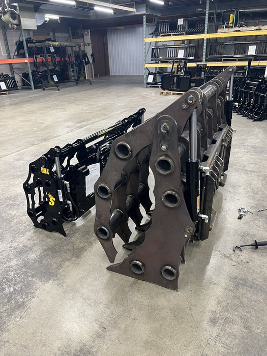 Rear perspective of the Stinger CG-XD tractor grapple bucket showcasing quick-attach mounting and hydraulic connections.