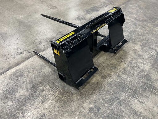 Stinger Attachments Series 1 bale spear lifting round hay bale – durable standard-duty attachment built for everyday farm use and efficient bale handling.